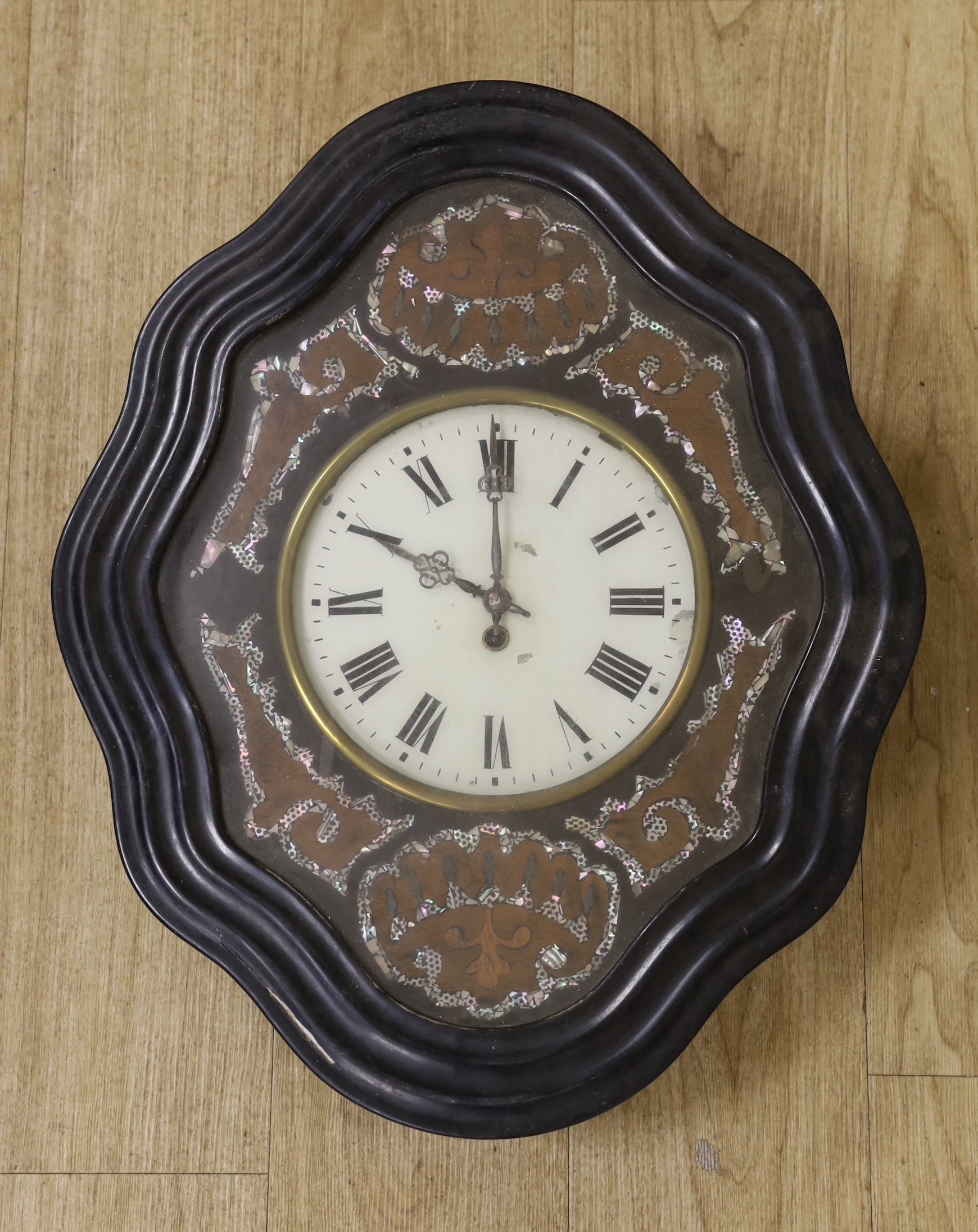 A 19th century French wall clock, with mother of pearl decorative face, 62 cms high x 50 cms wide